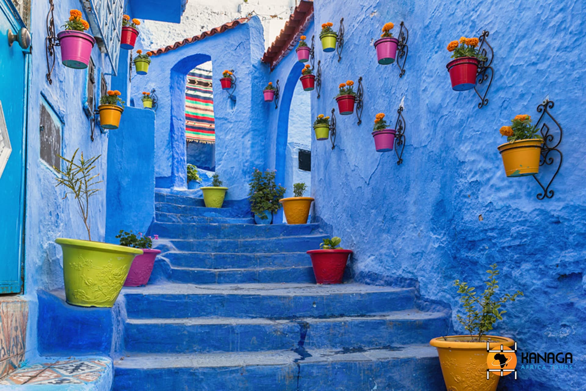 Blue Staircase And Wall Decorated With Colourful Flowerpots, Che